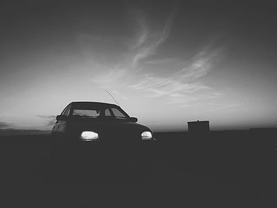 Silhouette Of Car With Turned On Light thumbnail