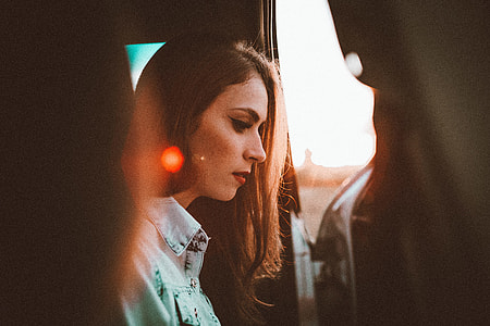 woman wearing blue chambray jacket sitting inside vehicle thumbnail