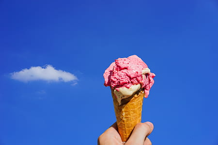 person holding pink ice cream thumbnail