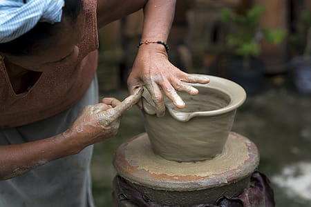 woman making plant pots out of clay thumbnail