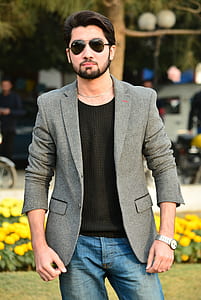 shallow focus photography of man standing on park thumbnail