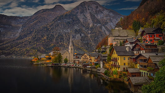 landscape photography of houses near lake thumbnail
