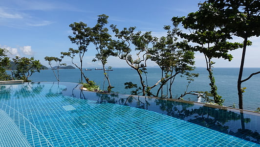 blue infinity pool during daytime thumbnail