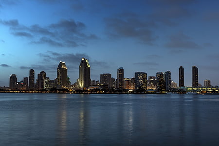 city building in front of body of water thumbnail