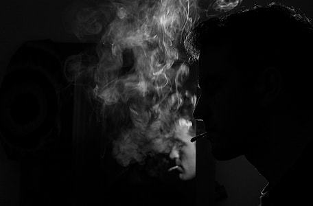black and white portrait of man smoking thumbnail
