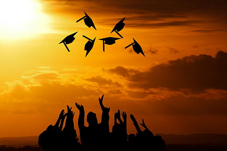 Caps fly into the air after graduation from high school, college or vocational school. thumbnail