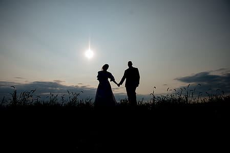 Silhouette of Man and Woman Holding Hands thumbnail