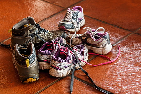 three pairs of assorted-color running shoes thumbnail