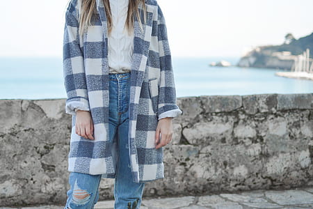 woman standing near concrete railings thumbnail