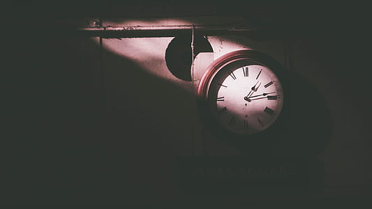 silhouette of round brown wooden framed white analog wall clock thumbnail