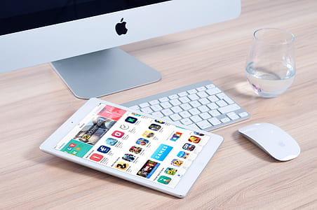 white iPad mini on silver Apple keyboard thumbnail