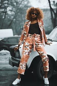 Woman Wearing Brown-and-white Cardigan With Matching Pants Sitting in White Vehicle thumbnail