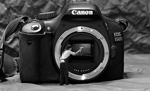 grayscale photography of Canon EOS 550D camera thumbnail