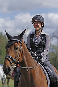 woman riding on horse during daytime thumbnail