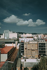 Brown, White, and Black Concrete High Rise Buildings thumbnail