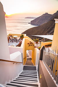aerial photography of yellow concrete house near mountain thumbnail