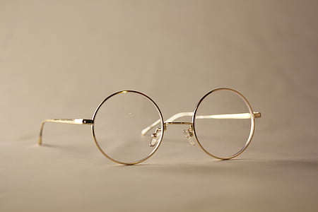 selective focus photo of gold framed hippie eyeglasses thumbnail