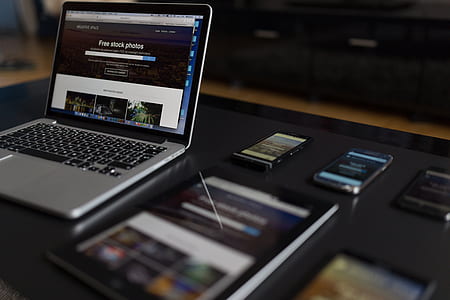 MacBook Pro on black desk thumbnail