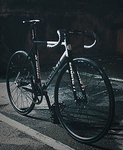 parked green and white Specialized road bike thumbnail