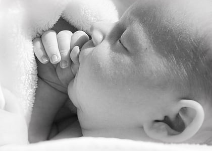 grayscale photo of baby thumbnail