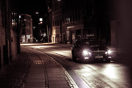 black Mercedes-Benz W212 on gray asphalted road with lights on thumbnail