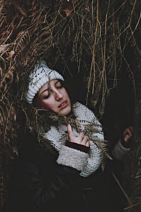 woman inside cave with plants thumbnail