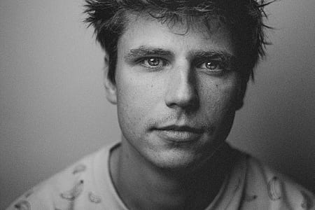 grayscale photo of man in crew-neck shirt thumbnail