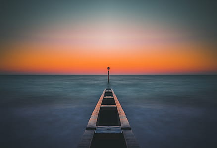landscape photography of empty boat on body of water during nighttime thumbnail