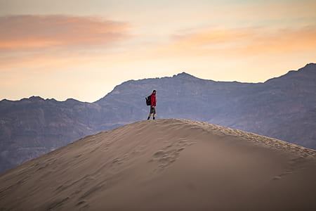 person standing on desert sand thumbnail