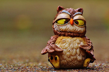 selective focus photograph of brown owl figurine thumbnail
