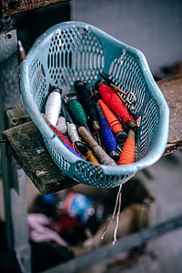 threads in blue plastic basket thumbnail