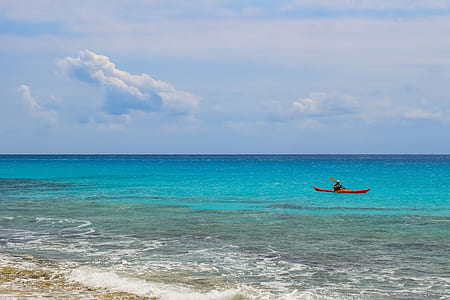 man sailing on sea during daytime thumbnail