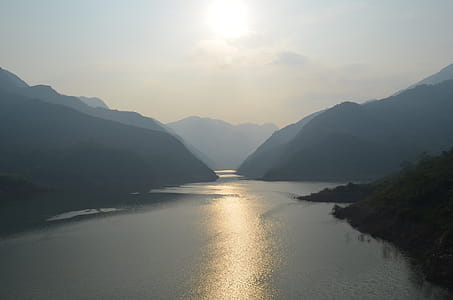 Brown Mountain Near Body of Water thumbnail