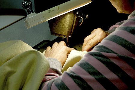 person sewing cloth thumbnail
