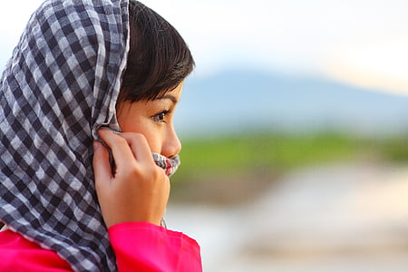 woman wearing black and white checked headscarf thumbnail