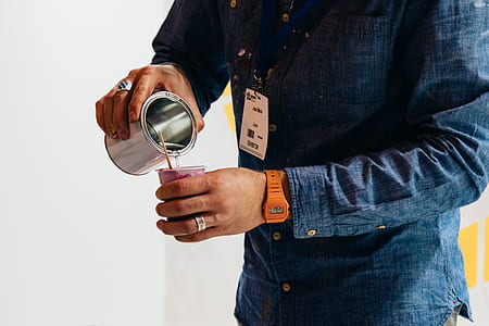 person holding cup and drinking glass thumbnail