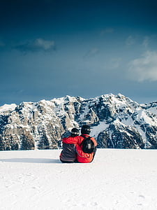 couple sitting on top of mountain thumbnail
