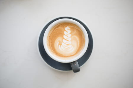 flat lay photography of coffee latte on cup thumbnail