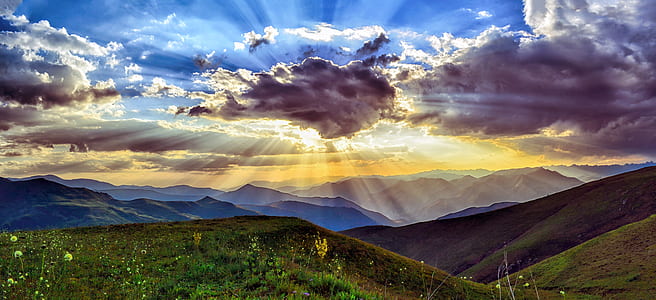mountains and sun covering by clouds thumbnail