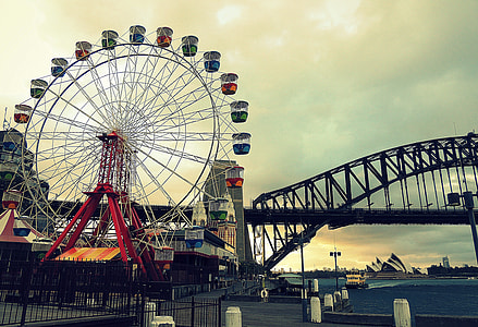 photography of Ferris wheel near bridge thumbnail