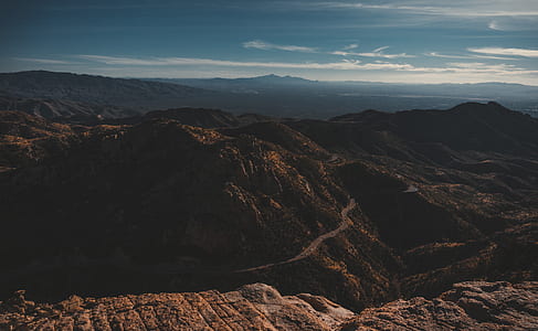 aerial photography of road beside mountain thumbnail