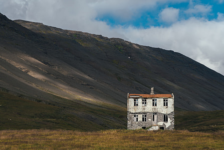 white and brown 2-storey building with mountain as background thumbnail