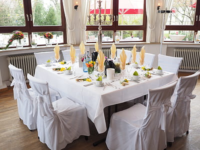white table with white chairs thumbnail