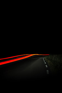 black and orange time lapsed photography during nightime thumbnail