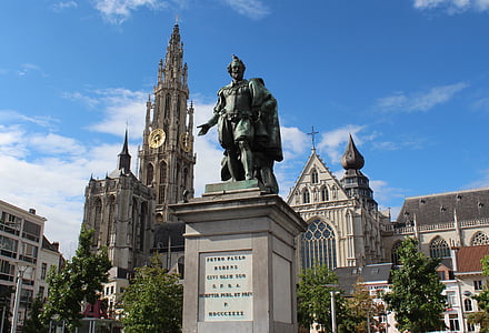 statue near building at daytime thumbnail