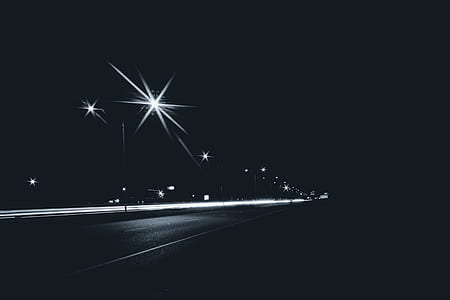 white road lights during night time thumbnail