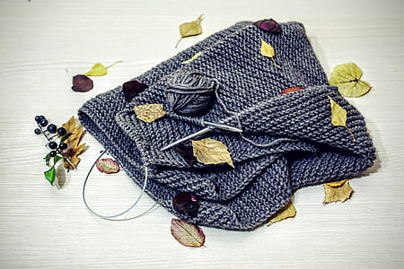 gray knitted bag on brown wooden surface thumbnail