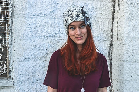 Photo of Woman in Maroon Top and Knitcap thumbnail