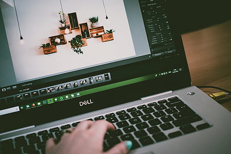Selective Focus Photo of Turned on Dell Laptop thumbnail