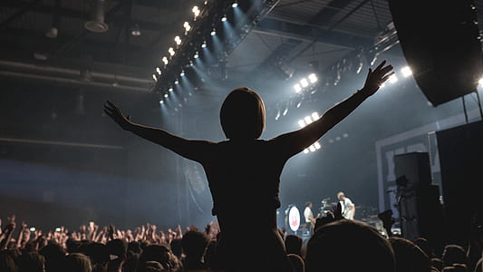 person raising both hands thumbnail